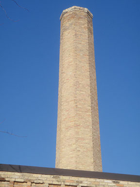 A chimney we repaired and tuckpointed to stop water from getting in and to improve how it looked. Repairs are not noticable. 